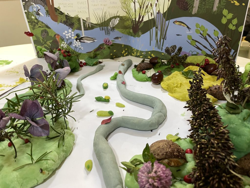 a photograph of a model of the glen made by children