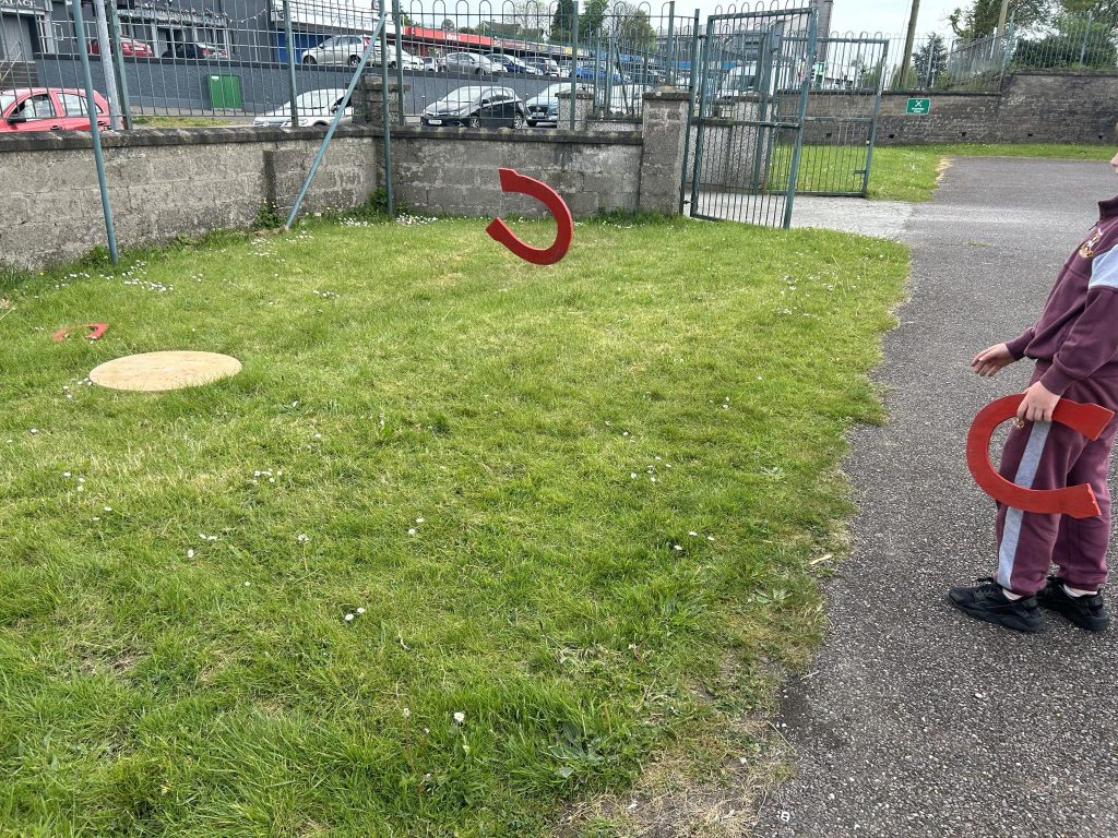 A photo of a painted horseshoe flying through the air