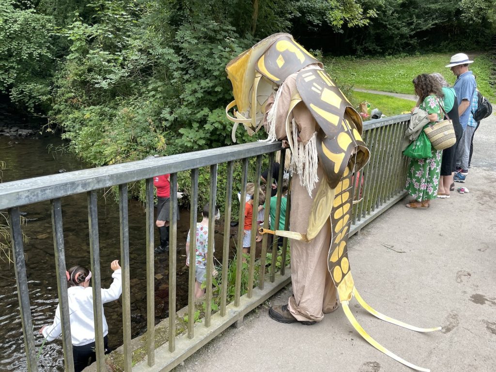 a photo of a man in costume of an invertebrate - the stonefly