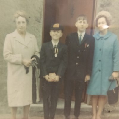 A photograph of a family grandmother, Anne Barry, her daughter and grandsons