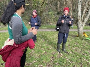 participants tuning in to the electro-magnetic field with divining rods