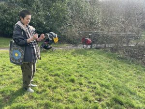 a participant holding divining rods