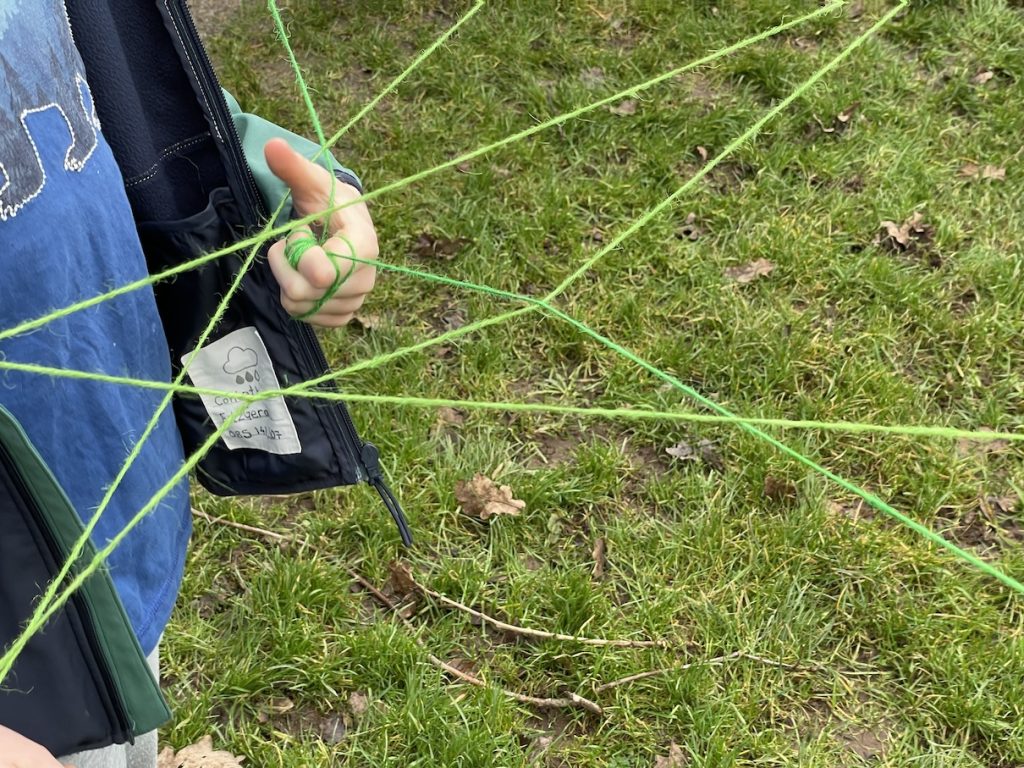 a photo of a child's hand holding the web