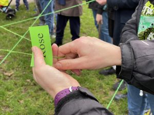 a photo of a hand holding a card saying "rose"