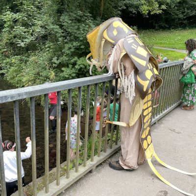 a photo of a man in costume of an invertebrate - the stonefly